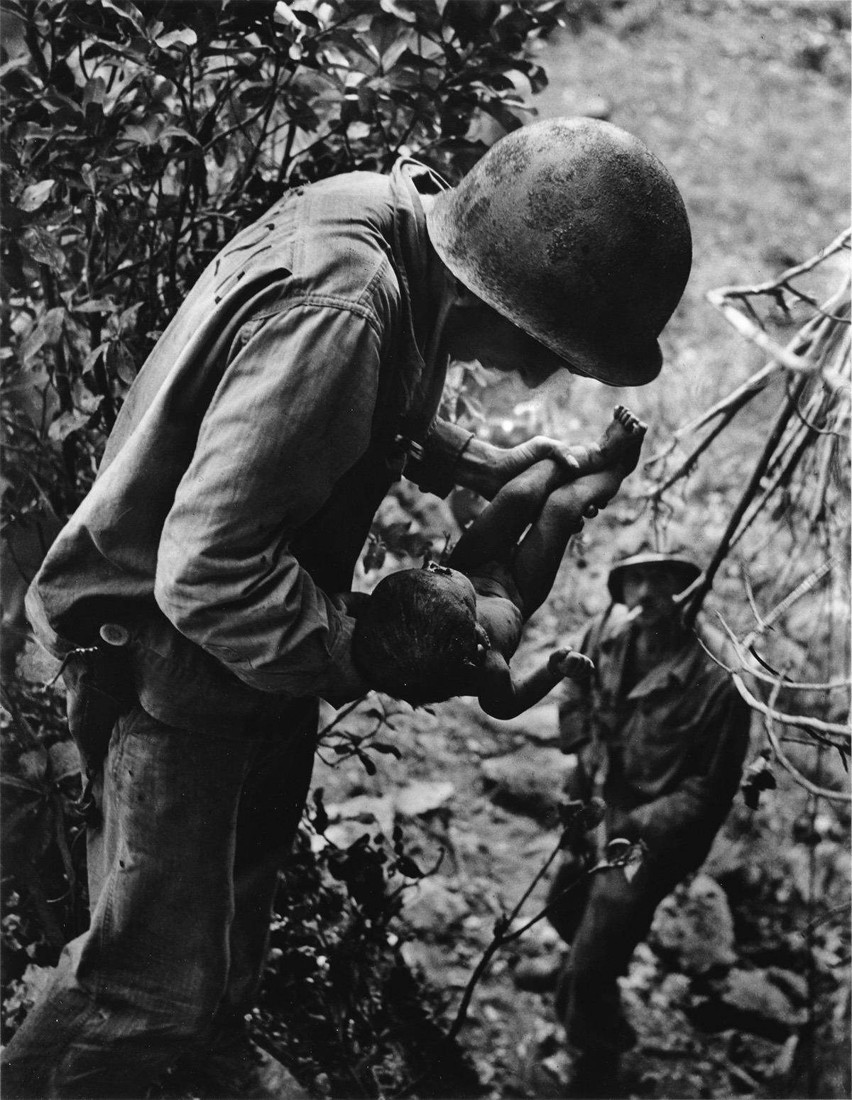 W. EUGENE SMITH (1918-1978) Saipan (soldier with an infant).